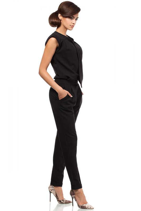 Stylish sleeveless jumpsuit with tapered cuffed legs and an envelope top, featuring darts, pockets, and a side zipper. Classy and elegant.