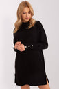 Model wearing black oversize knit dress with ribbed texture and button details on sleeves, perfect for everyday wear.