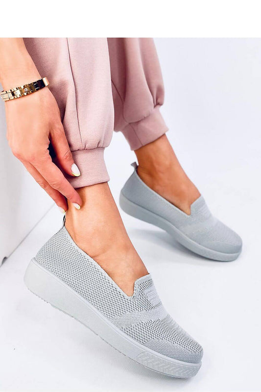 Stylish slip-on sneakers with perforated design, ideal for comfort and lightness. Perfect everyday wear for modern women.