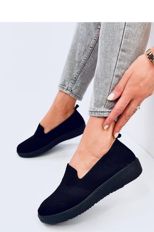 Black slip-on model 195147 by Inello, lightweight and comfortable, perfect for everyday wear. Features a breathable perforated fabric design.