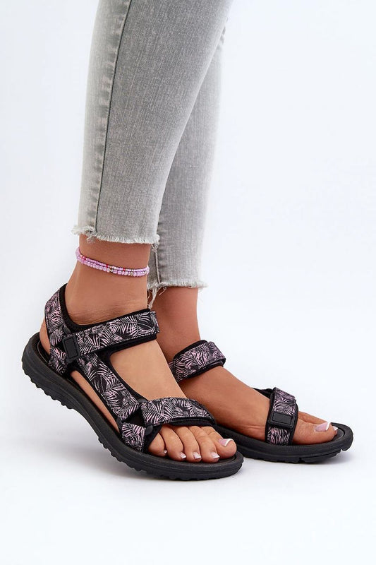 Woman wearing model 197895 sports sandals with adjustable straps, perfect for active days. Stylish and comfortable footwear for summer adventures.