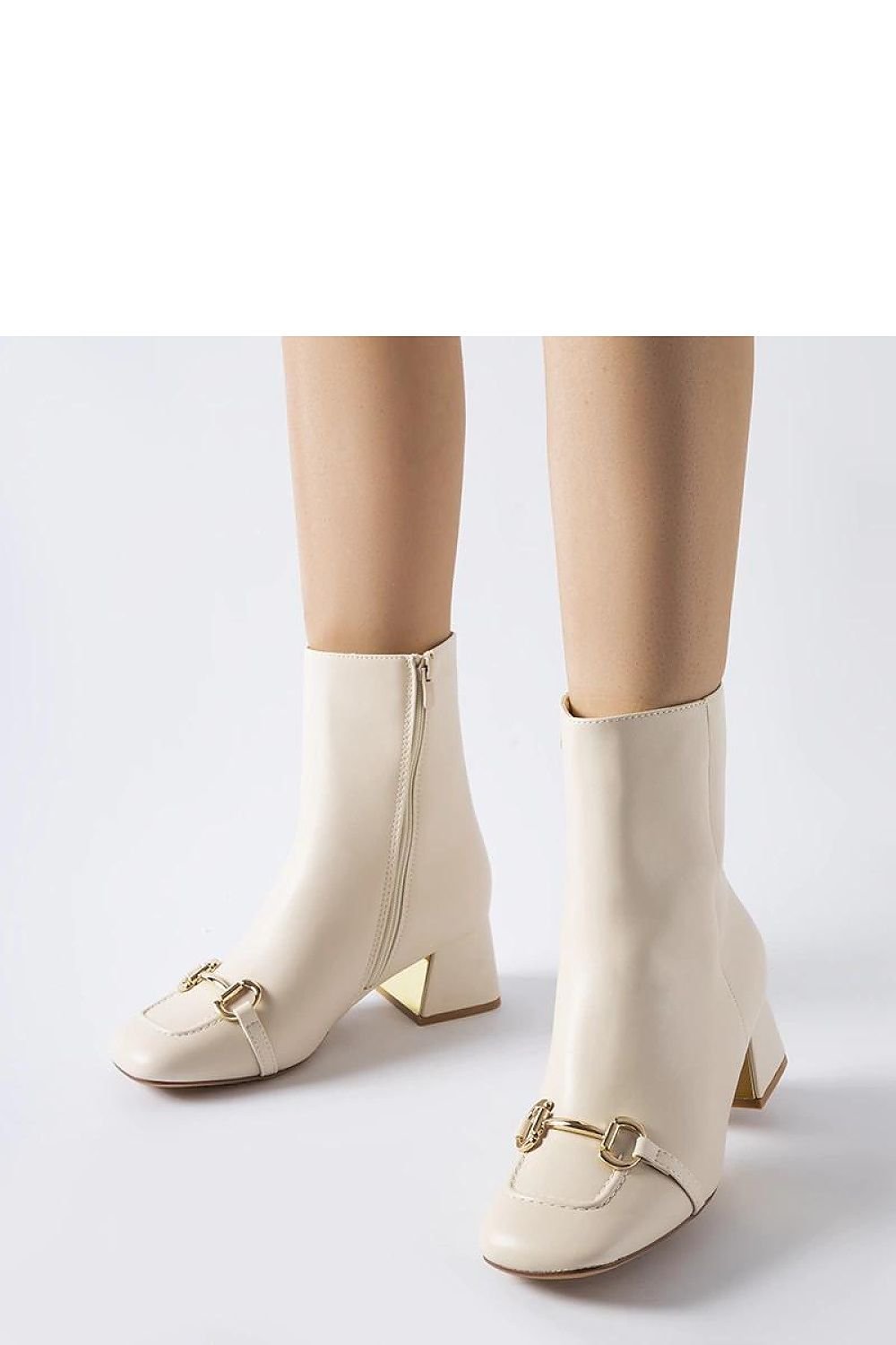 Elegant beige high-heeled ankle boots with zipper and decorative buckle, perfect for autumn and winter fashion.