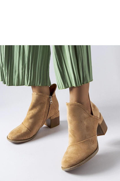 Beige heeled ankle boots with zipper by Busson, perfect blend of comfort and style for women. Available in flat and medium heel options.