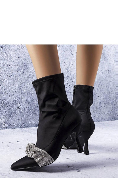 Elegant stiletto ankle boots with pointed toe and side zipper, perfect for stylish evenings and special occasions.