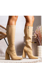 Elegant beige high-heeled ankle boots perfect for fall. Features pointed toe and slim fit to enhance the legs. Stylish and comfy.