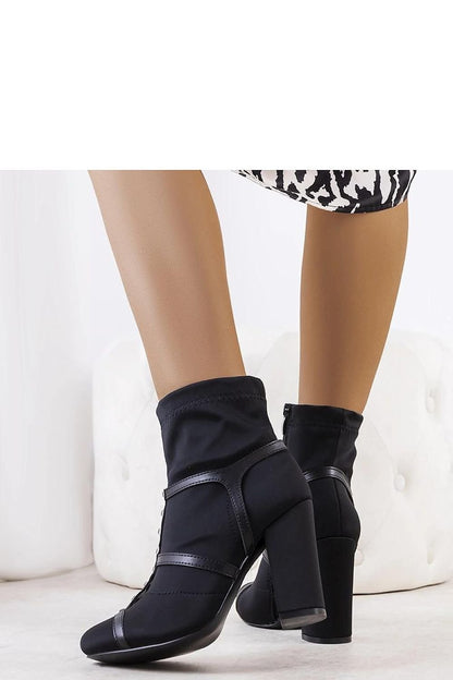 Chic black high heeled ankle boots for women, sleek and stylish, perfect with coats or jackets. Dagma brand, model 204851 Solea.