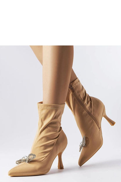 Elegant beige high-heeled ankle boots with rhinestone bow from the Mars collection, perfect for autumn and winter fashion.