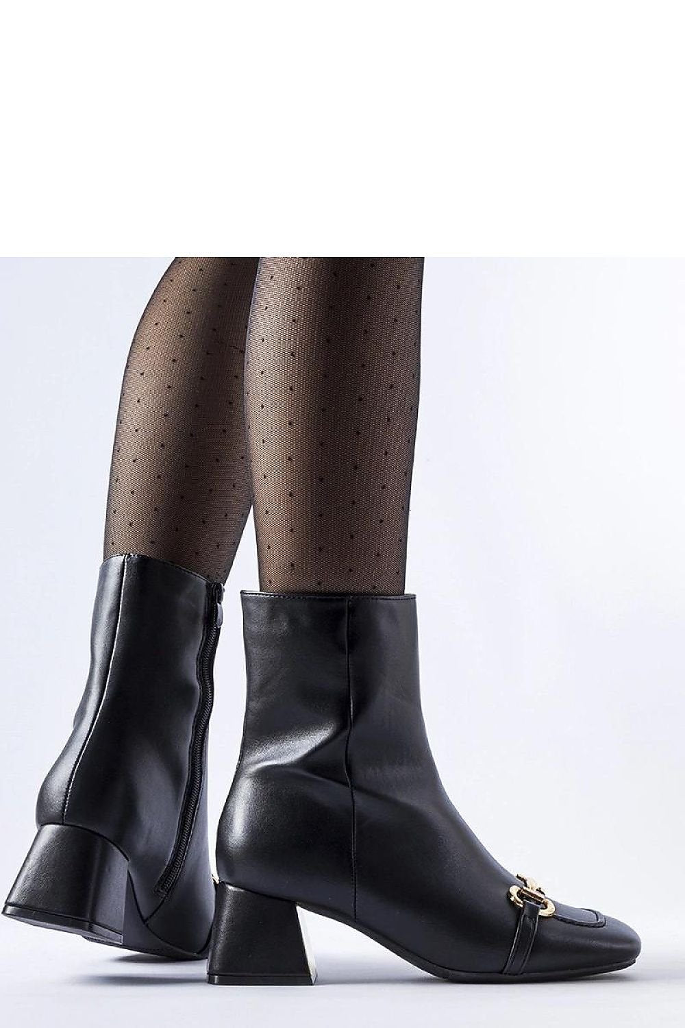 Chic black ankle boots with square toe and gold buckle detail, perfect for modern fall and winter fashion.