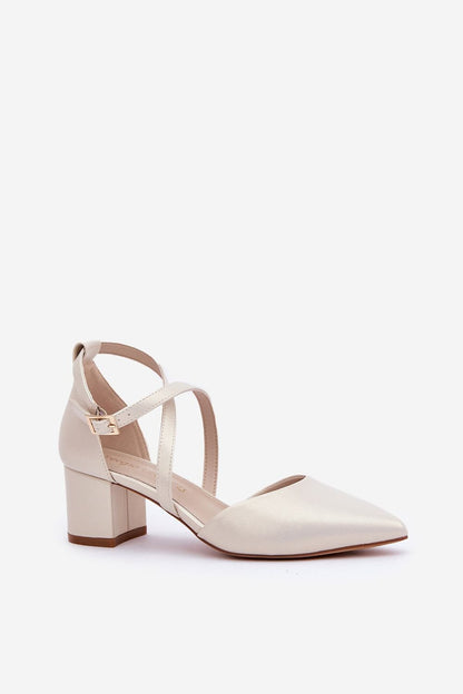 Beige high heel women's shoes with cross straps and low block heel for elegance and comfort.