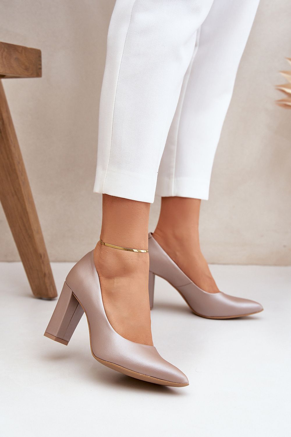 Woman wearing elegant beige high heels from Lewski Shoes, perfect for stylish comfort. Check out the full collection!