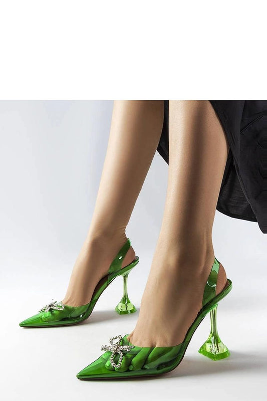 Model wearing green transparent high heels with 15 cm stiletto, featuring beige soles and elegant design for summer style.