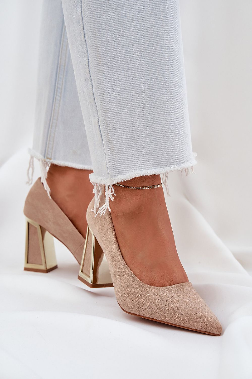 Elegant high heel court shoes with metallic block heels and beige suede finish, perfect for stylish evening occasions.