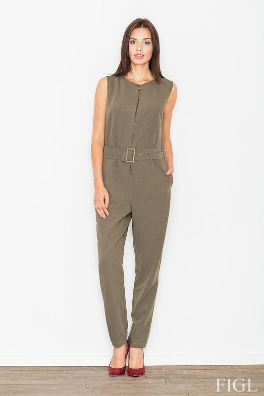 Model wearing Figl Overál 61529, sleeveless jumpsuit with zipper, and belted waist, in olive green, standing on wooden floor.