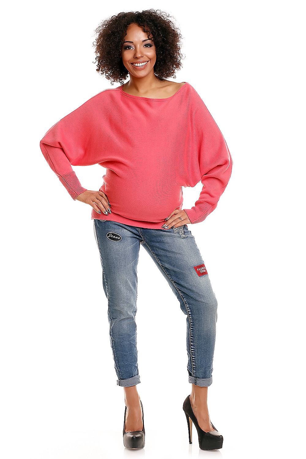 Model wearing PeeKaBoo maternity sweater 84269 in pink, with boatneck design and long sleeves, stylishly paired with jeans.