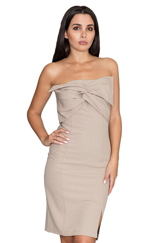 Elegant beige strapless dress with front bow and side slit, perfect for formal occasions.