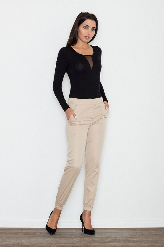 Woman wearing Figl 111103 elegant pants, paired with a black top, showcasing stylish and comfortable design. Made from polyester and spandex.