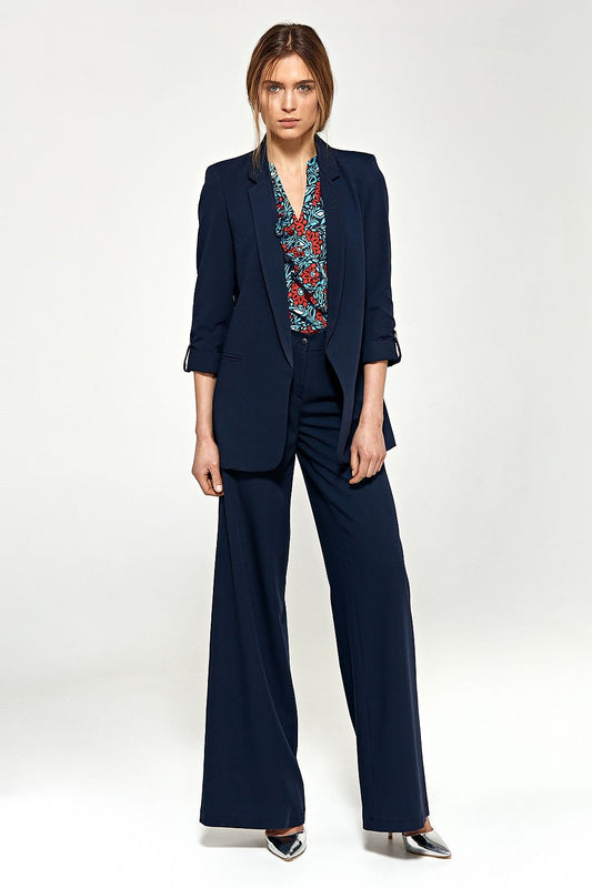 Model wearing Nife women's palazzo pants, navy blazer, patterned blouse, showcasing a stylish and trendy season look.