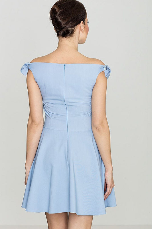 Back view of light blue sleeveless dress with bow shoulder detail, highlighting feminine silhouette.