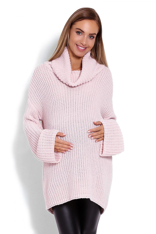 Cozy maternity turtleneck sweater in blush pink by PeeKaBoo. Features wide sleeves and oversized fit, perfect for comfort and style.