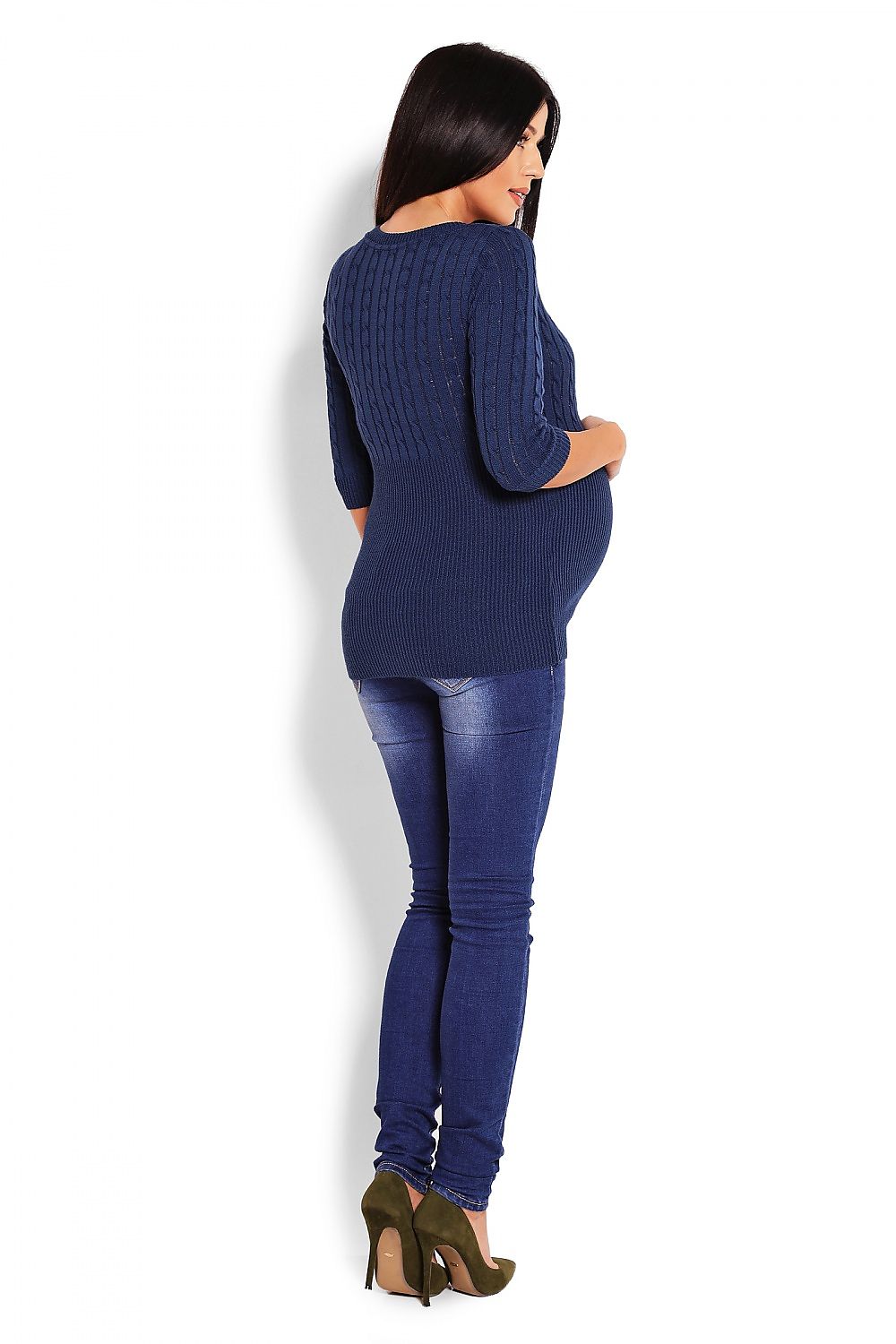 Pregnant woman wearing a blue fine-knit maternity sweater with cable design, 3/4 sleeves, and a round neckline, paired with jeans.