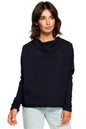 Woman wearing Szabadidőfelső model 124060 BeWear, loose fit pullover with ribbed sleeves, draped neckline, and subtle back cutout.