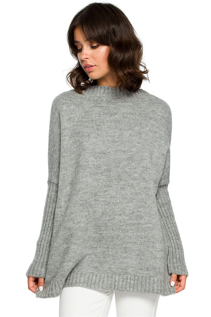 Elegant grey knit pullover with kimono sleeves, perfect for pairing with trousers, skirts, or casual jeans for a stylish look.