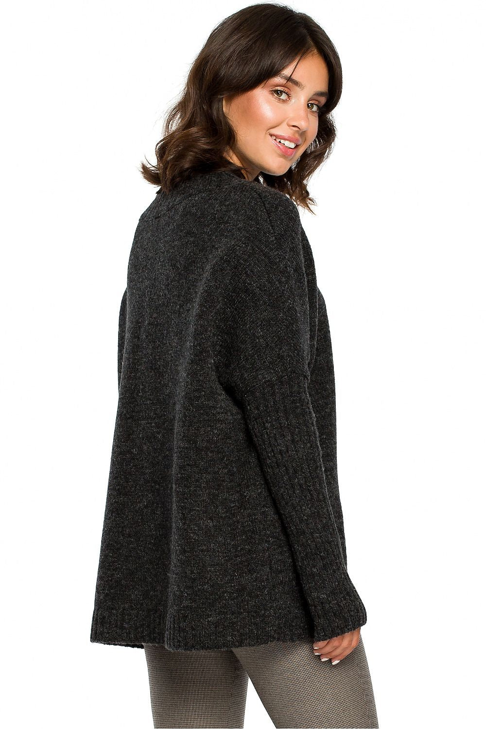 Model wearing an elegant, dark gray pullover sweater with kimono sleeves, perfect for pairing with trousers, skirts, or jeans.