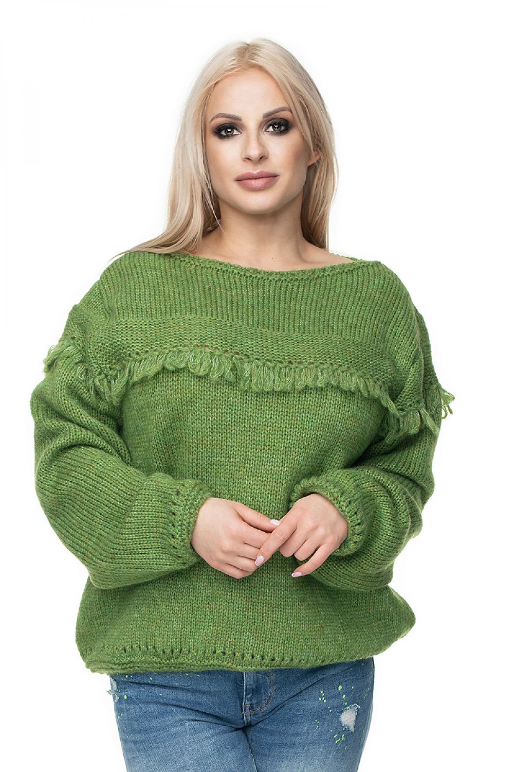 Woman wearing a green woolen Pulóver model 131603 PeeKaBoo with decorative tassels, perfect for various occasions.