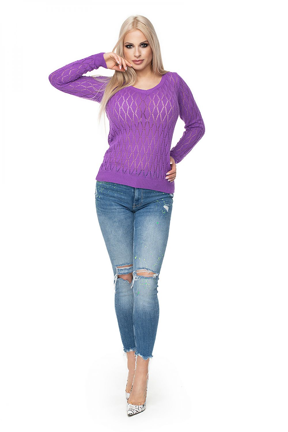 Model wearing purple PeeKaBoo sweater with diamond motif, paired with ripped jeans.