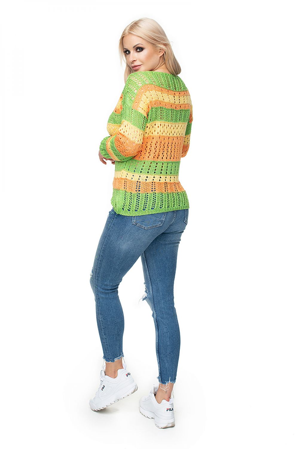 Model wearing PeeKaBoo Pulóver 131612, a colorful short sweater with openwork texture and stripes, made of soft acrylic blend.