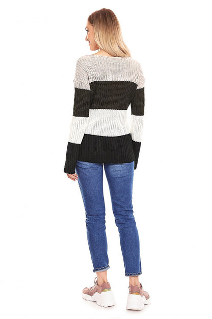 Woman wearing striped maternity sweater model 132018 PeeKaBoo, featuring long sleeves and dense knit in black and cream.