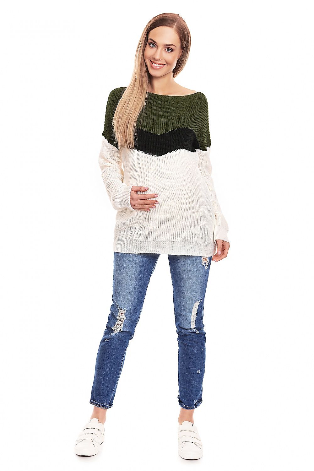 Woman wearing a long-sleeve maternity sweater with a boat neckline, color-block design, and ripped jeans. Perfect for stylish comfort.