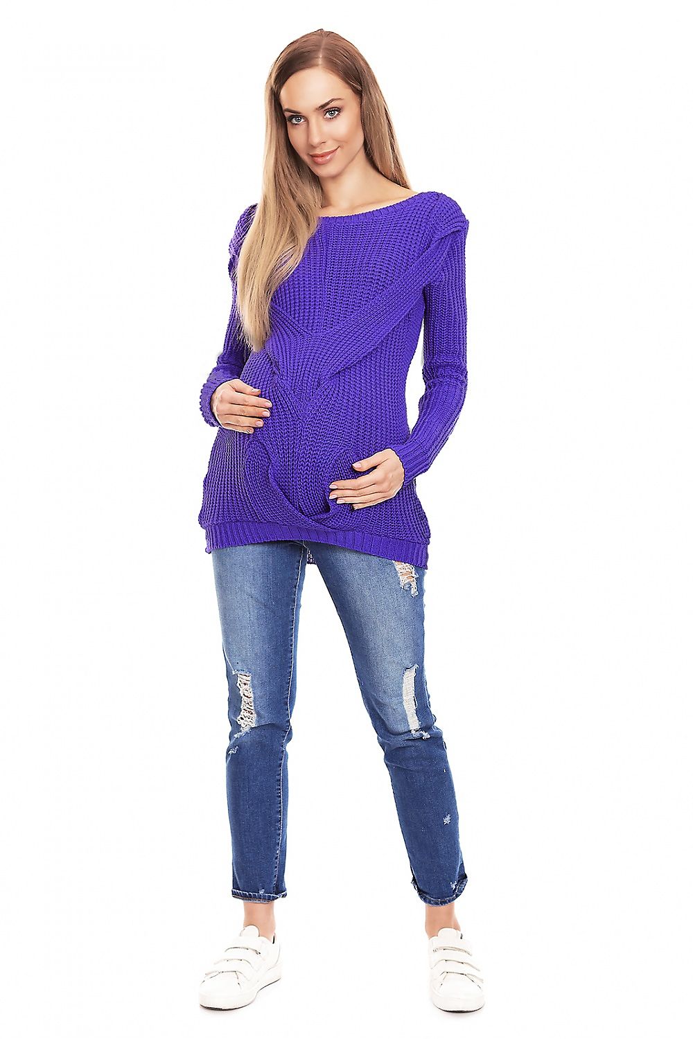 Pregnant woman wearing a purple knit maternity sweater with decorative front braid, boat neckline, and blue jeans from PeeKaBoo.