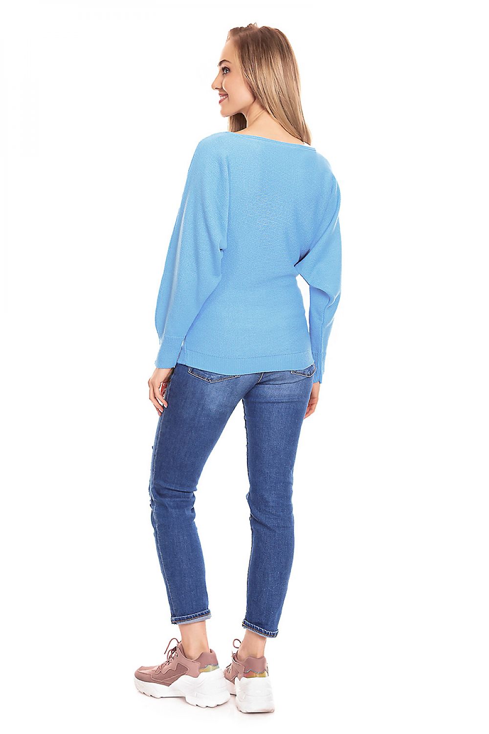 Back view of a blue oversized maternity sweater with boat neckline and long sleeves, paired with jeans and sneakers.