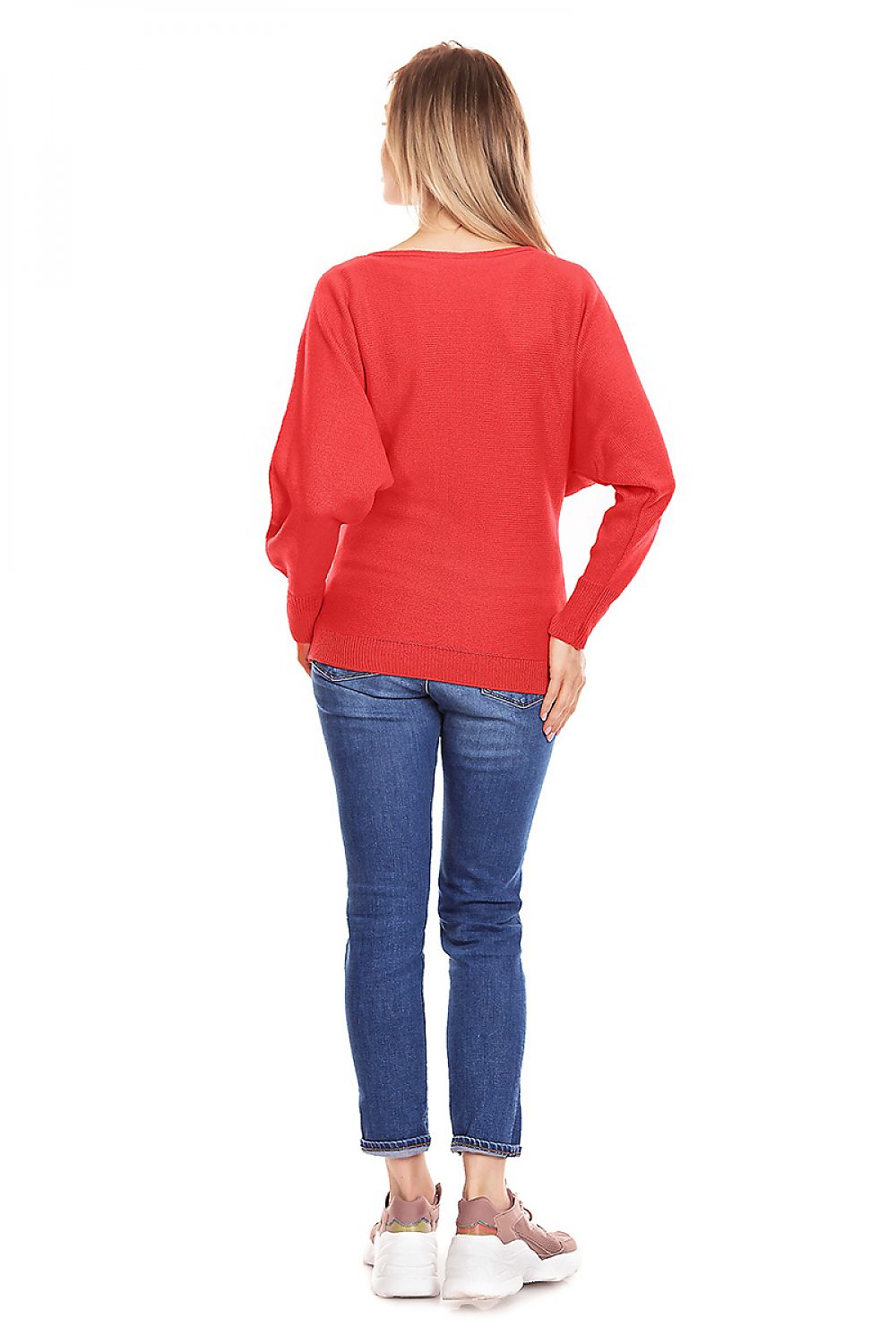 Back view of model wearing red oversized maternity sweater, casual jeans, and sneakers.