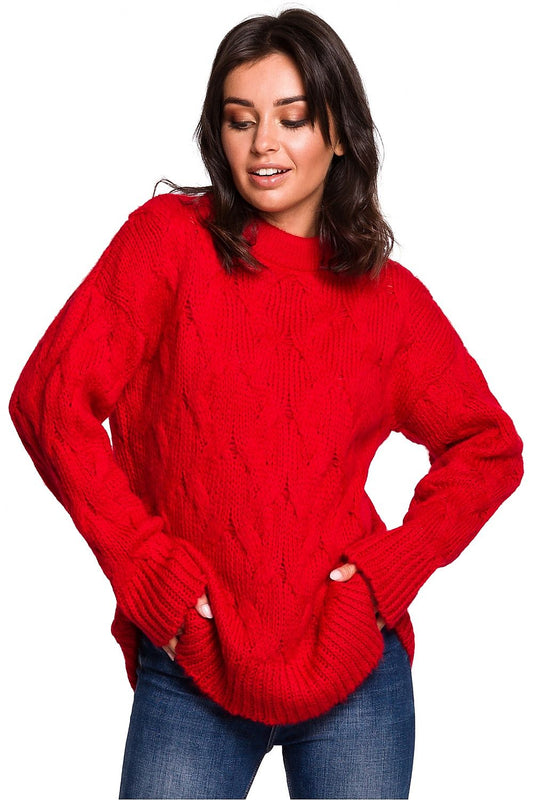 Model wearing a vibrant red knit pullover, perfect for autumn/winter, showcasing classic cozy style.