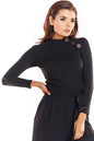 Model wearing fitted black pulóver with button details, long sleeves, ideal for autumn office style. Designed in Poland.