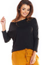 Woman wearing a classic black knit pullover with long sleeves, styled with mustard pants. Made from a viscose blend.