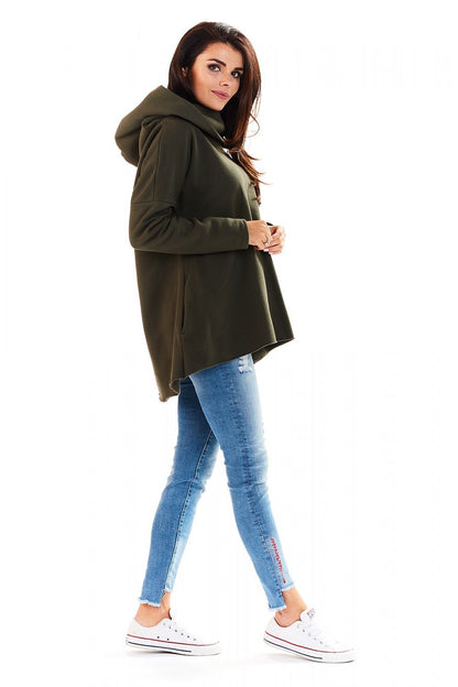 Woman wearing green Szabadidőfelső model 139968 awama hoodie with jeans, featuring long sleeves and a large hood. Casual, sporty look.