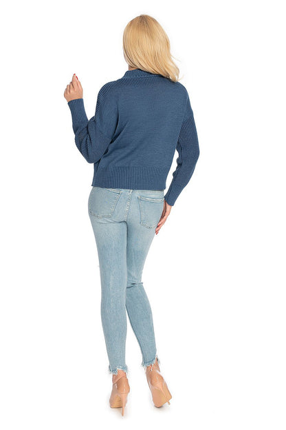 Back view of woman wearing blue loose-fit pulóver with long sleeves and jeans. Model 146913 PeeKaBoo stylish fashion.