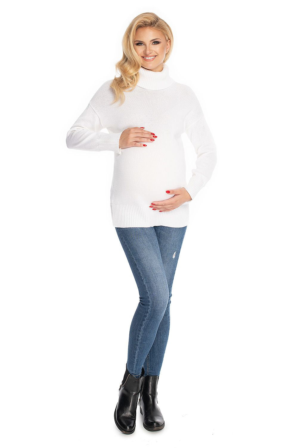 Pregnant woman in white turtleneck maternity sweater, model 147491 by PeeKaBoo, posing with hands on belly.