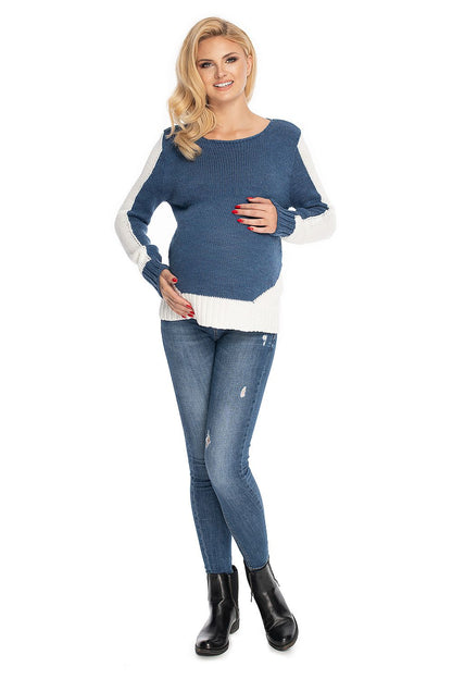 Blue maternity sweater model 147497 by PeeKaBoo with boat neckline and side accents, made of 100% acrylic, worn by a model.