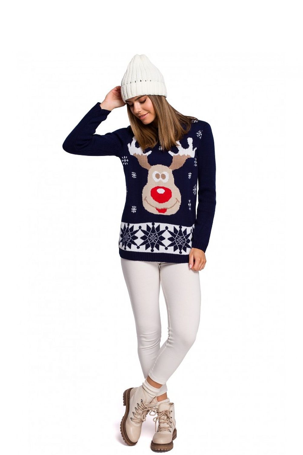 Festive Christmas sweater with reindeer design worn by model in cozy winter outfit, perfect for holiday celebrations. Limited edition.