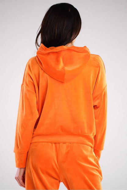 Vibrant orange velour hoodie with classic loose fit, perfect for casual wear. Made in Poland, ideal with jeans and sneakers.