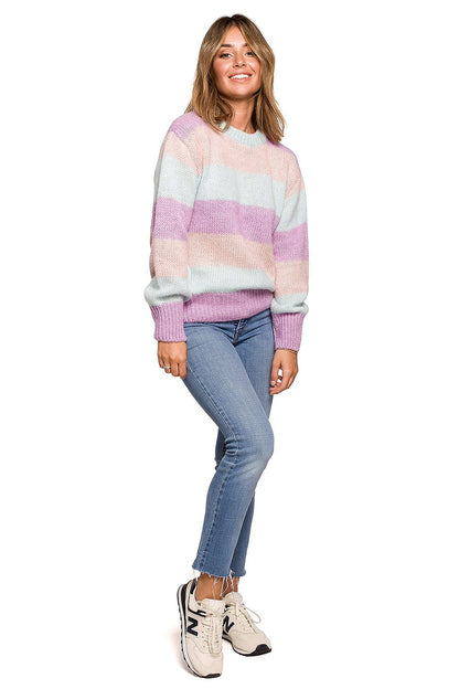 Woman wearing multicolored striped pullover model 157606 BE Knit with jeans, showcasing casual fall-winter fashion.