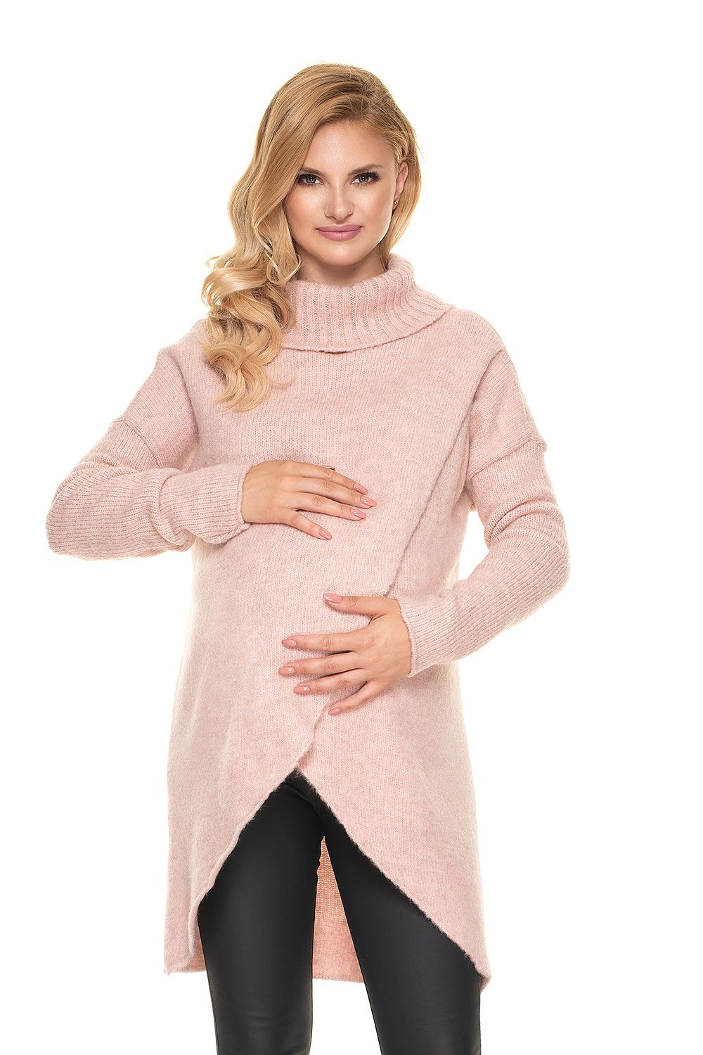 Woman wearing a soft, fluffy pink maternity sweater with asymmetrical design suitable for nursing.