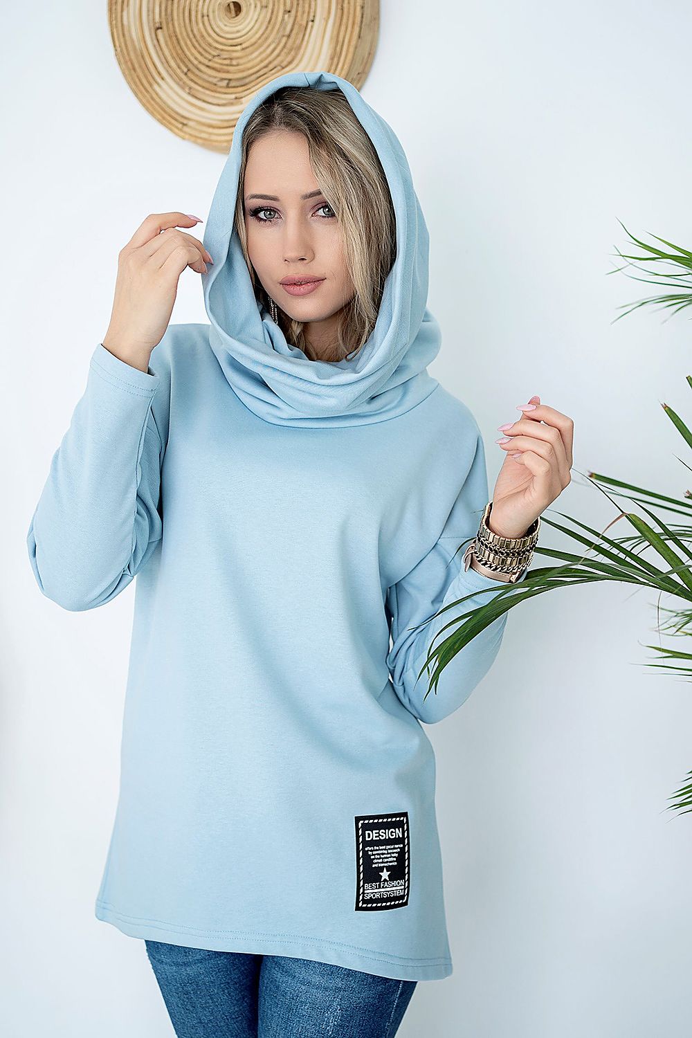 Light blue pullover with draped collar transforming into hood, featuring stylish design and comfort. Perfect for casual chic outfits.