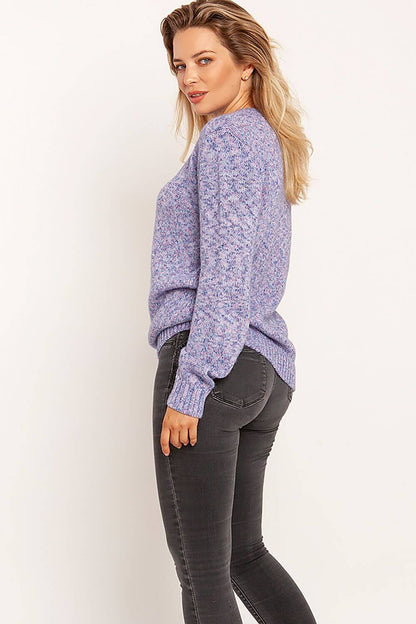 Woman wearing a purple melange pullover, side view, paired with dark jeans, perfect for autumn and winter fashion.