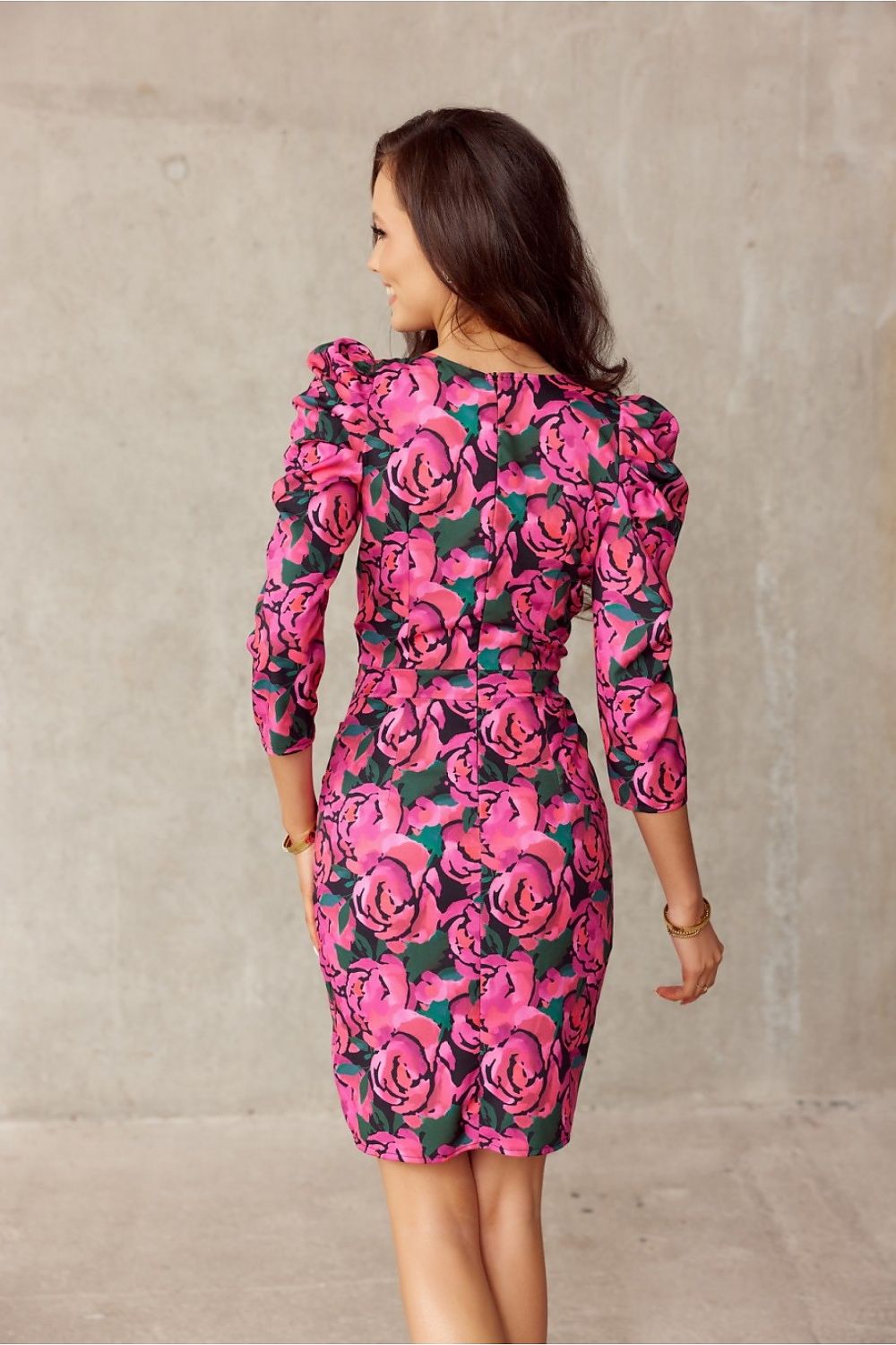 Elegant pink floral dress with puff shoulders from Roco Fashion, highlighting a flattering ruched silhouette.