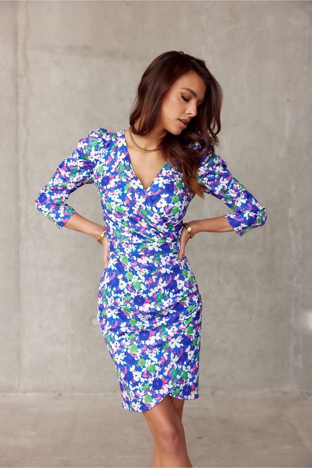 Elegant floral wrap dress with ruched design and layered neckline, ideal for comfort and style.